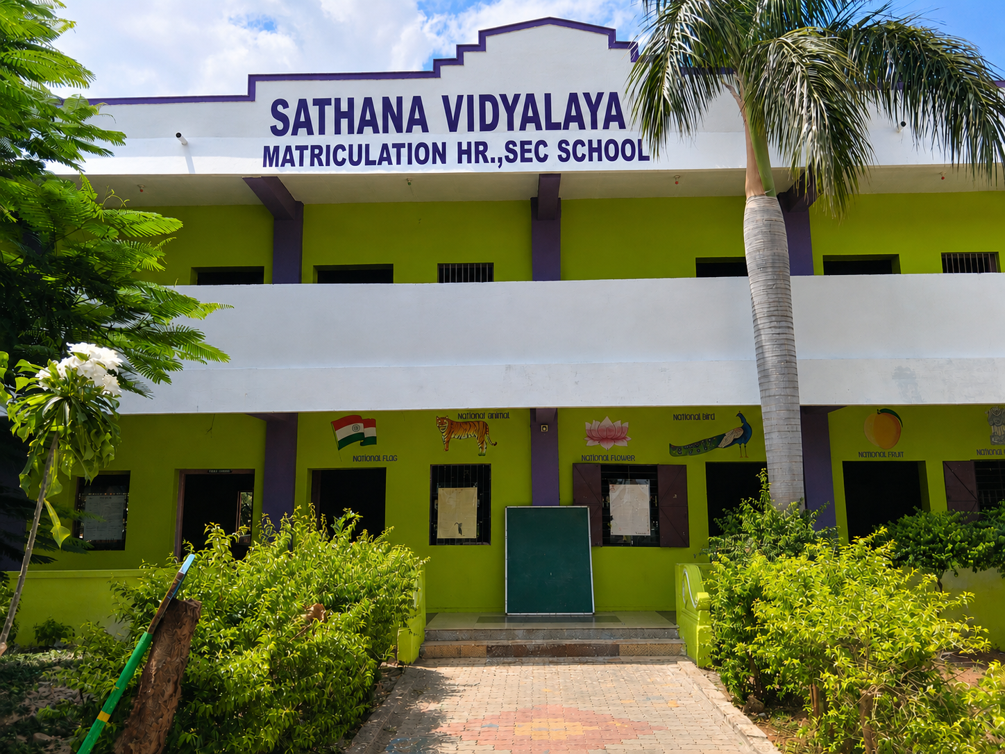 Green and white Sathana Vidyalaya school building